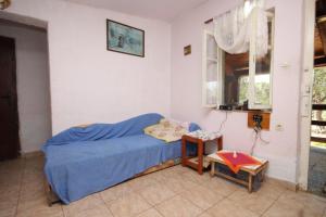 Ένα ή περισσότερα κρεβάτια σε δωμάτιο στο Seaside house for families with children Cove Kobiljak, Pasman - 320