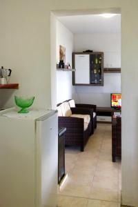 a kitchen and a living room with a couch at Secluded fisherman's cottage Cove Zuborovica, Pasman - 322 in Mrljane