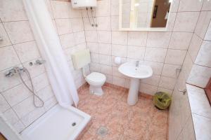 a bathroom with a toilet and a sink and a shower at Rooms by the sea Pag - 278 in Pag