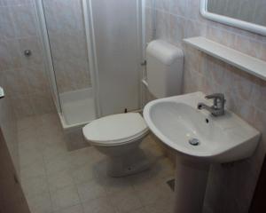 a bathroom with a toilet and a sink at Apartments by the sea Podgora, Makarska - 316 in Podgora