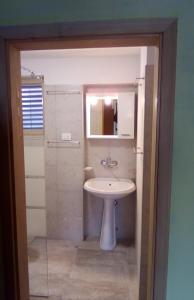 a bathroom with a sink and a mirror at Apartment Valun 386a in Valun