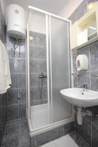 a bathroom with a shower and a sink at Apartments and rooms by the sea Zaglav, Dugi otok - 393 in Sali