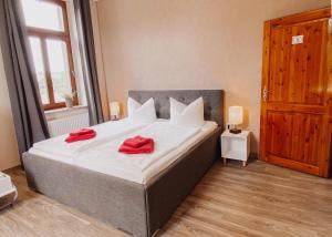 Postel nebo postele na pokoji v ubytování Hotel Am Rittergut