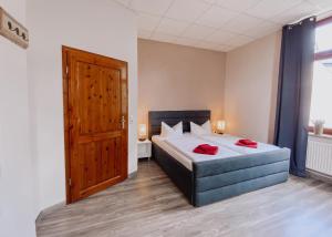 Postel nebo postele na pokoji v ubytování Hotel Am Rittergut