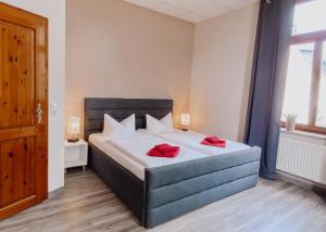 Postel nebo postele na pokoji v ubytování Hotel Am Rittergut