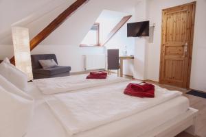 Postel nebo postele na pokoji v ubytování Hotel Am Rittergut