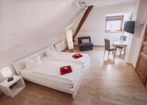 Postel nebo postele na pokoji v ubytování Hotel Am Rittergut