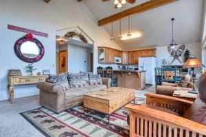 a living room with a couch and a table at Mountain Vistas - Lake Views at Buffalo Sunrise in Green Mountain Falls
