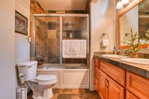 a bathroom with a toilet and a shower and a sink at Mountain Vistas - Lake Views at Buffalo Sunrise in Green Mountain Falls +15 photos