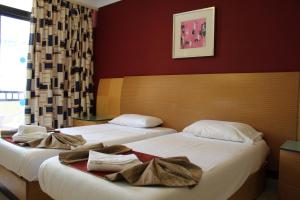 Postel nebo postele na pokoji v ubytování The St. George’s Park Hotel