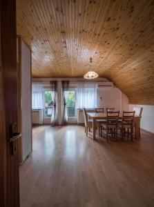 a dining room with a table and chairs at Apartments with a parking space Smoljanac, Plitvice - 14979 in Smoljanac