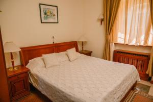 Postel nebo postele na pokoji v ubytování Kaštel Ečka