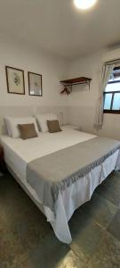 Cama o camas de una habitación en Pousada da Vila