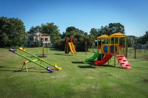 a park with a playground with slides and play equipment at Mellmell en la Sierra in Tandil