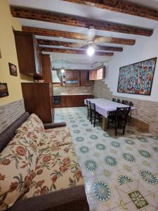 a living room with a couch and a table at Casa Geloso in Ustica