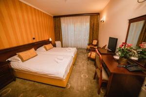 Postel nebo postele na pokoji v ubytování Kaštel Ečka
