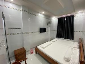 Postel nebo postele na pokoji v ubytování Motel Phạm Lũy