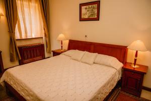 Postel nebo postele na pokoji v ubytování Kaštel Ečka