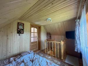 Posteľ alebo postele v izbe v ubytovaní Mini Cottage