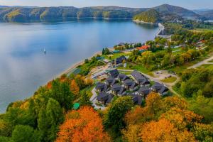 an aerial view of a resort on the shore of a lake at White Sails Solina in Solina
