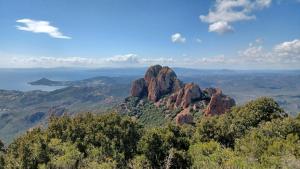 a view of a rock formation in the mountains at Village Cap Estérel Agay St Raphaël vue mer et piscine in Agay - Saint Raphael