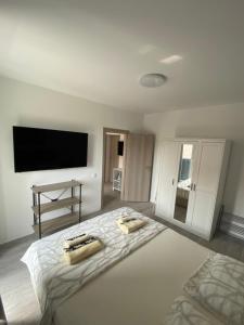 Postel nebo postele na pokoji v ubytování Apartments Ena