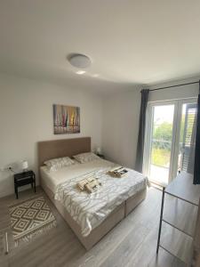 Postel nebo postele na pokoji v ubytování Apartments Ena