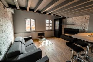 a living room with a couch and a table at Wonder Duplex 7 in Toulouse