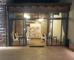 a dining room with tables and chairs in a room at Art & Jazz Hotel in Catania