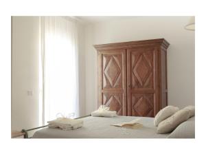 A bed or beds in a room at Corso Emanuele Apartments