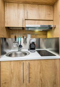 New Azzurro Deluxe tesisinde mutfak veya mini mutfak