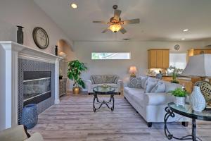 a living room with a couch and a fireplace at Family-Friendly Modesto Home with Grill and Yard in Modesto