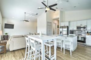 a kitchen and living room with a table and chairs at Tampa House with Patio, Near Downtown and Beaches! in Tampa