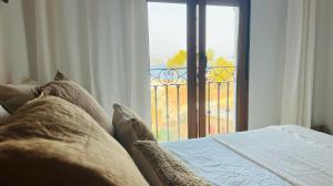 Łóżko lub łóżka w pokoju w obiekcie Casa adosada panorámica al mar