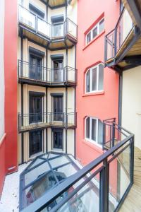 a glass walkway in front of a building at Hôtel Boutique Richelieu, Lyon Gare Part-Dieu in Lyon