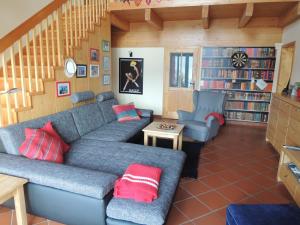 a living room with a couch and two chairs at Haus Jana in Hermagor