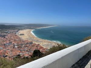 a view of a beach and the ocean at Casa Boa Onda in Nazaré