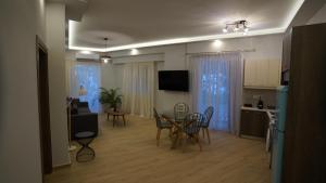 Televízia a/alebo spoločenská miestnosť v ubytovaní Ventiri Family Suite 1