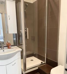 a bathroom with a shower and a sink at Cannes Vieux Port Seafront & Seaview, fast wifi in Cannes