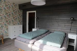 Postel nebo postele na pokoji v ubytování Lapland Lodge