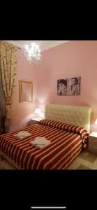 A bed or beds in a room at Guest House Biondi