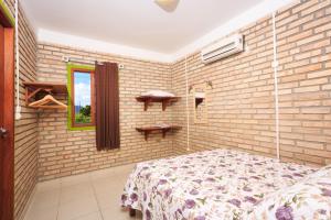 Ένα ή περισσότερα κρεβάτια σε δωμάτιο στο Apê Namastê