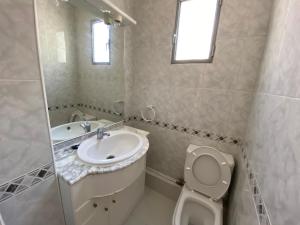 a bathroom with a sink and a toilet and a mirror at piso para jovenes familia cerca playa y centro . BLASCO IBANEZ A in Valencia