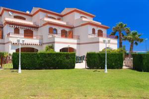 a large house with a lawn in front of it at UHC Arenal II Family Complex in Hospitalet de l'Infant