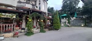 a street in a town with a building at Apartments Daut's Tower in Sarajevo