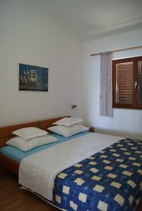 Postel nebo postele na pokoji v ubytování Apartments by the sea Zavala, Hvar - 553