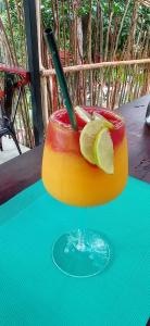 a drink with a stick in it on a table at Island Paradise, Saboga Lodge and Villa Noelia in Panama City