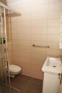 a bathroom with a toilet and a sink at Seaside apartments with a swimming pool Tri Zala, Korcula - 558 in Korčula