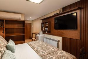 TV a/nebo společenská místnost v ubytování Hotel Vivenda dos Sonhos