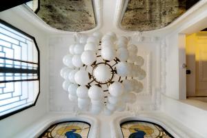 a chandelier with white balloons hanging from a ceiling at Magnova Vitality Boutique Hotel in Istanbul